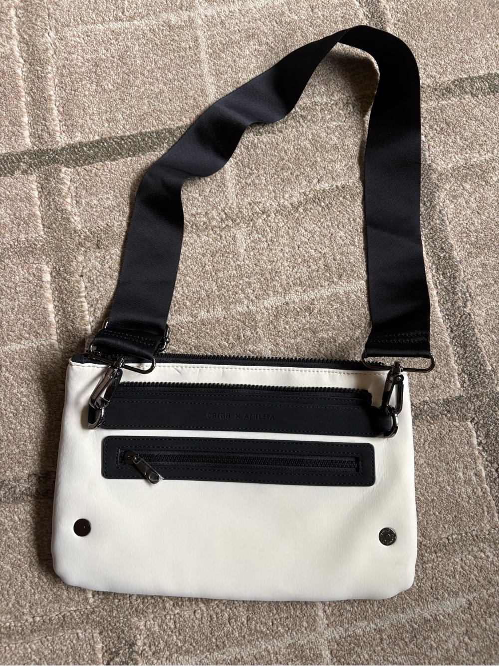 white and black Caraa x Athleta crossbody bag